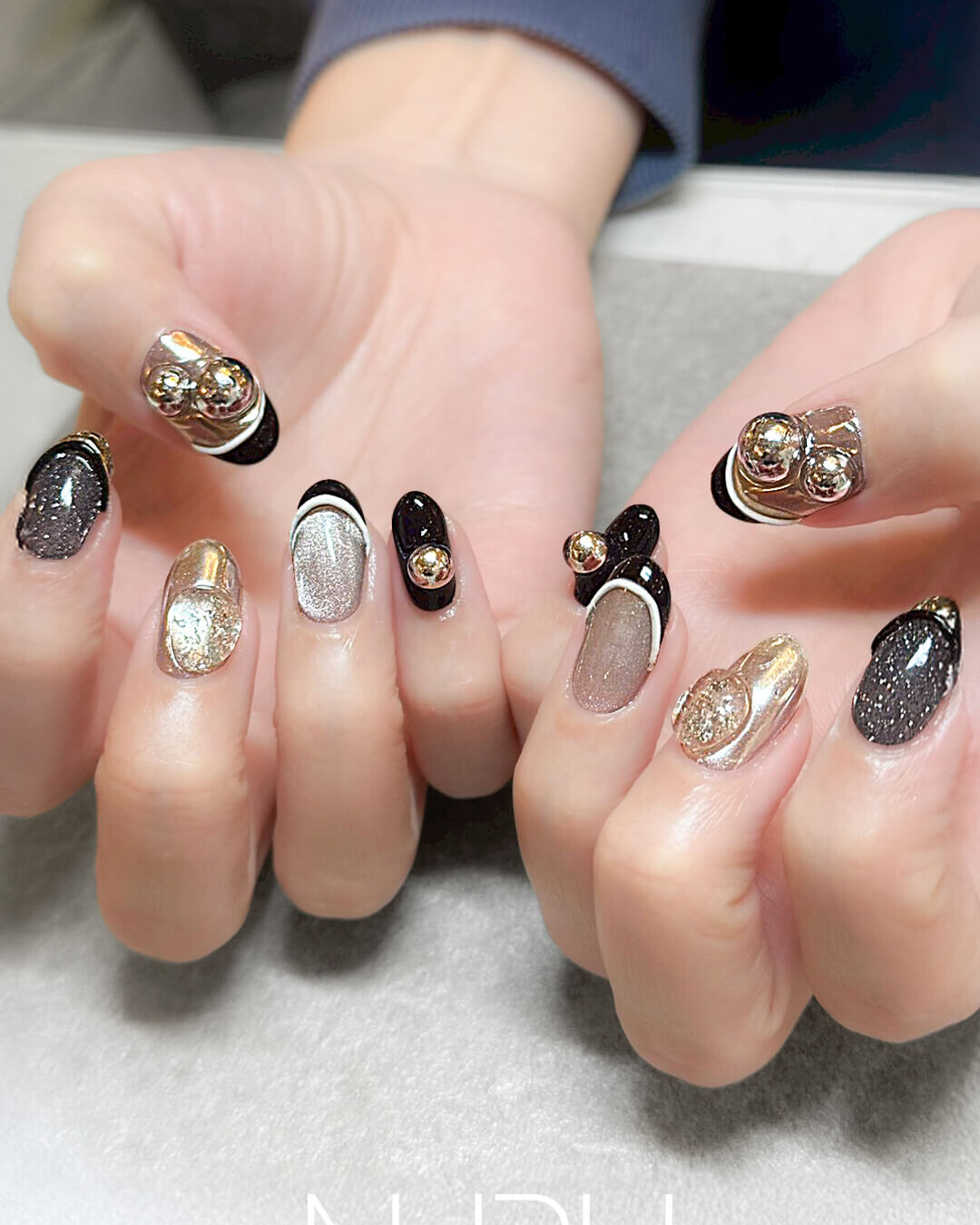 大胆パーツ！NURUのブラック×モード系ネイル